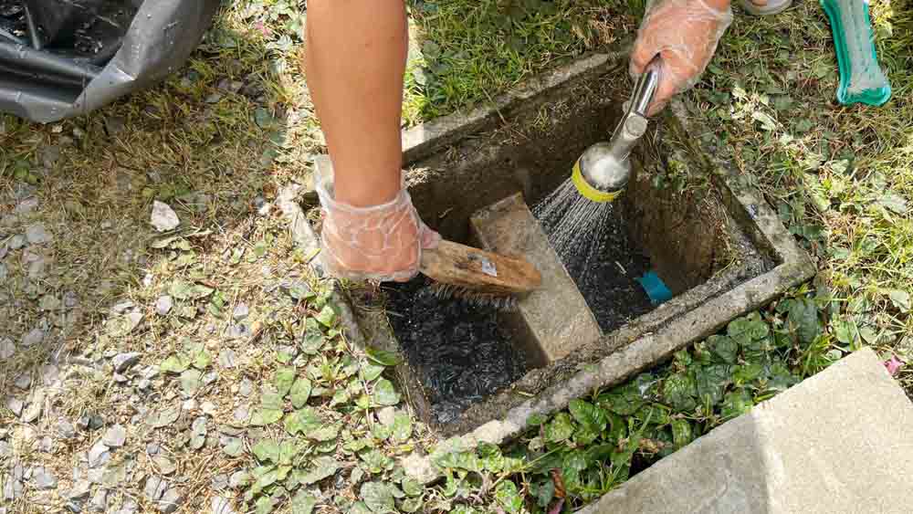 cleaning a grease trap